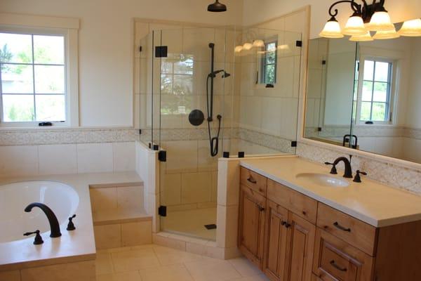 Custom shower, slab vanity tops and slab tub deck.