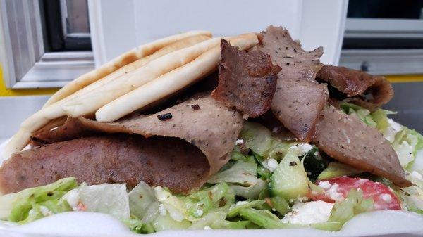 Greek Salad with Gyro Meat: Gyro Meat, Lettuce, Onion, Tomato, Cucumber, Feta Cheese, Kalamata Olives & Greek Dressing, Served with Pita