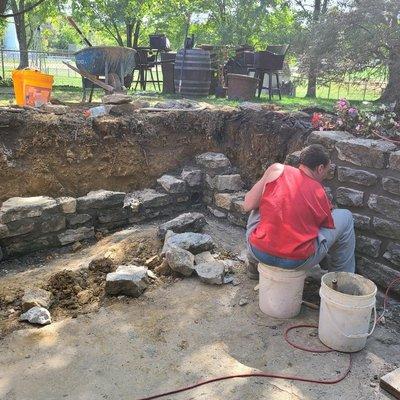 Stone wall 5 foot tear down and extension with major tuckpointing repairs