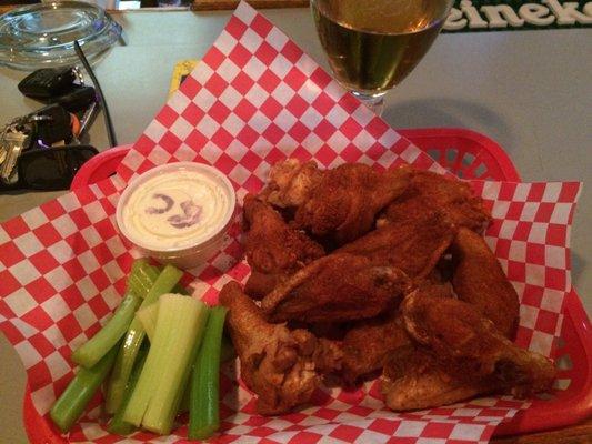 Siracha dry rub wings from the club. I gagged on the first bite and they're making my eyes water!!   Super good though!!  Good lawd!!!!