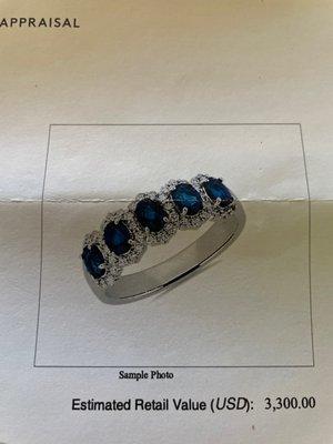 Lady's 14 karat white gold, sapphire and diamond ring (from receipt/appraisal).