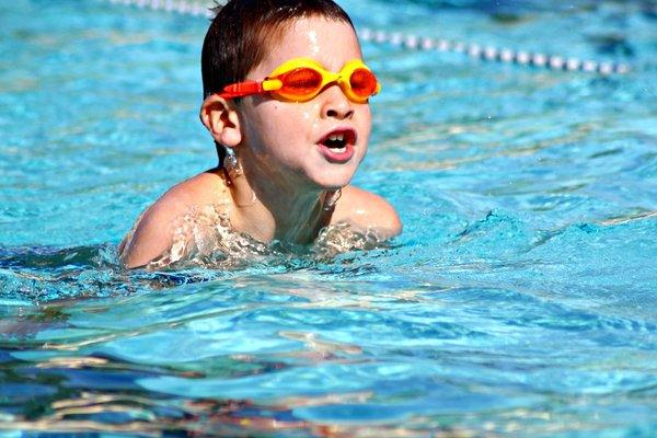 One of our swimmers, swimming the breast stroke, a survival and competitive swimming stroke.