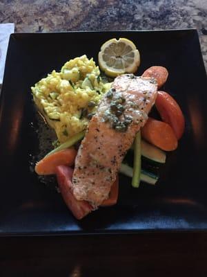 Salmon in capers and white wine sauce. Saffron rice. Delicious