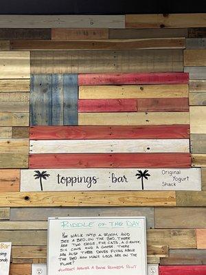 American flag above the toppings bar, plus a new riddle every time we come in!