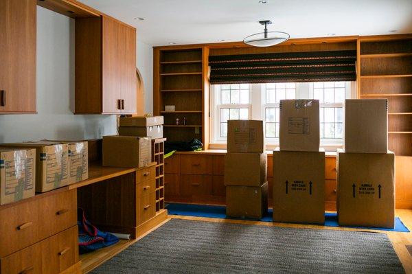 Pack boxes for a residential move. Reynolds Transfer & Storage, Inc.