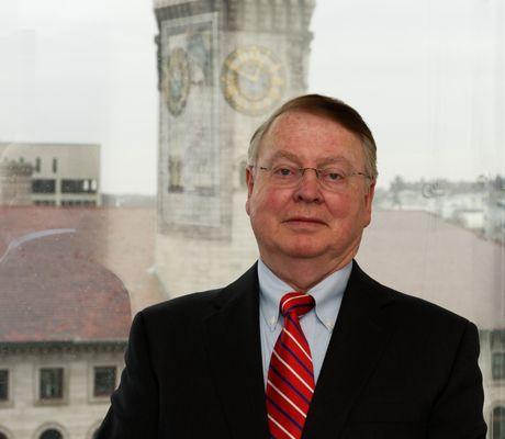 Photograph of Dave in the office. He has over 35 years of investment experience.