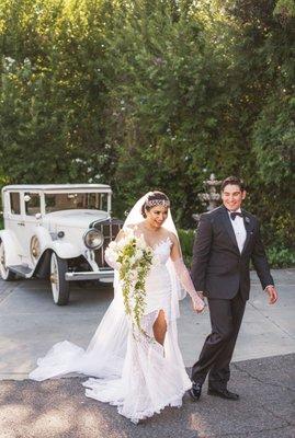 My husband and I on our big day wearing a Brides by Liza gown