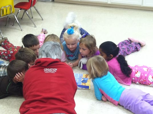 Mrs. Moore reading a story at Little Sheep Preschool!