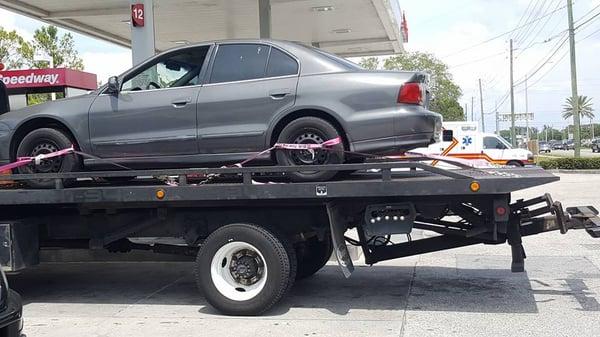 Towing on Flatbed with Car Securely Fastened