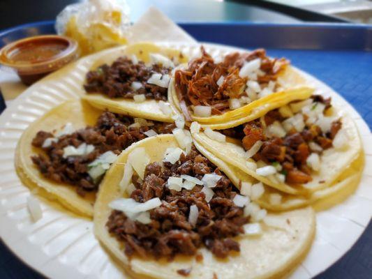 Three carne asada, birria and al pastor tacos