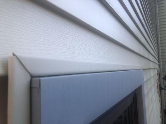 This is of a window near the door, an example of what the capping and siding used to look like