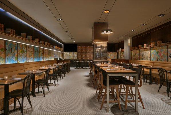 Dining Space with library wall full of NYC experiences to discover