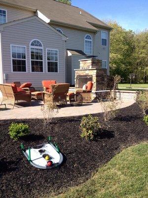 Costum fire place & Patio with Ep Henry pavers & stone veneer.