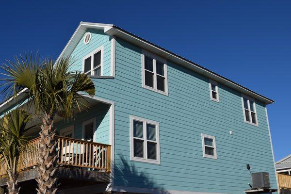 We replaced the original vinyl siding on this home with James Hardie Color Plus siding in the beautiful aqua marine color!