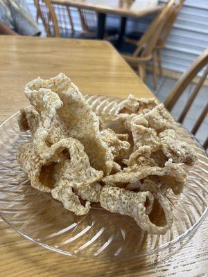 Complimentary pork rinds