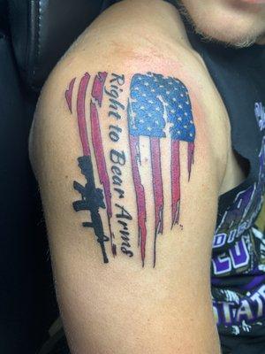 Right to bear arms and colored flag tattoo