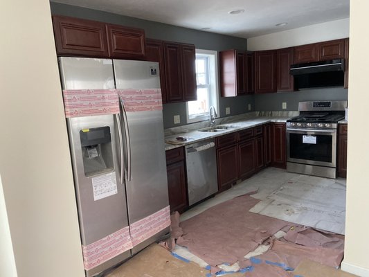 New construction painted kitchen with accent walls.