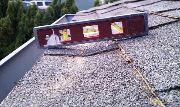 Most common reason water leaks behind gutters. The gutter was installed to high which caused the rain water to wick back.