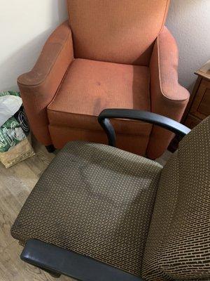 Both chairs in the room were stained.