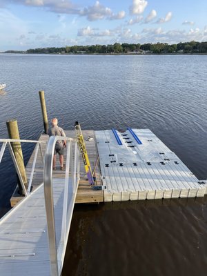 Our Ez Boatport attached with a hinge to wooden floating dock.