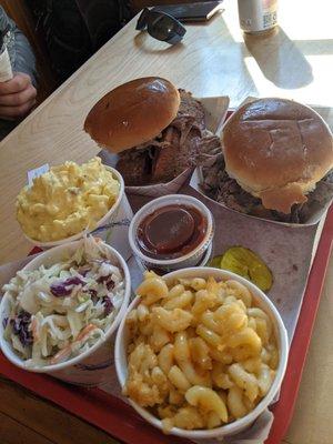 Pit beef and brisket sandwiches with sides.