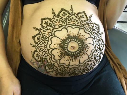 Henna tattoo on a pregnant lady