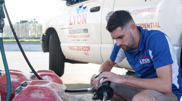 Justin the son of the father & son owned Florida Roofing company Lyon Home Enterprises, getting supplies for the storm