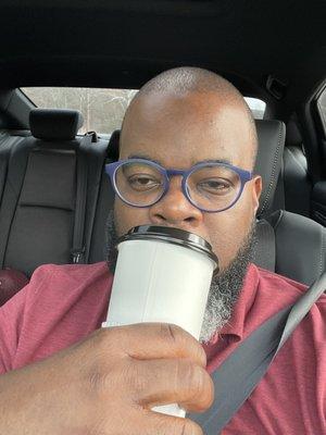 Me sipping my cup after being lied to by hotel staff.