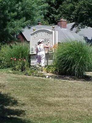 repainting the sign at the road!