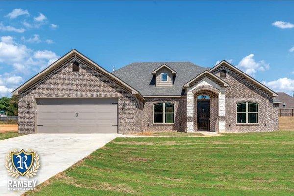 Sprinklers were repaired, and making the grass green on this house in Diana, Tx