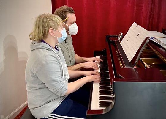 Piano lesson in progress