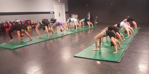 Our studio is a certified Acrobatic Arts studio, and all of our Acro Dance classes following their progression based syllabus.