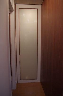 Nine foot pocket door aligning perfectly against cabinet.