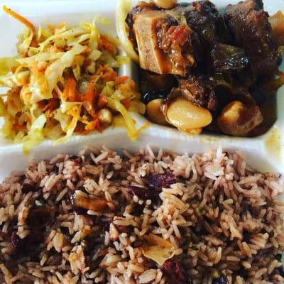 Oxtail with red beans and rice , side of steam vegetables