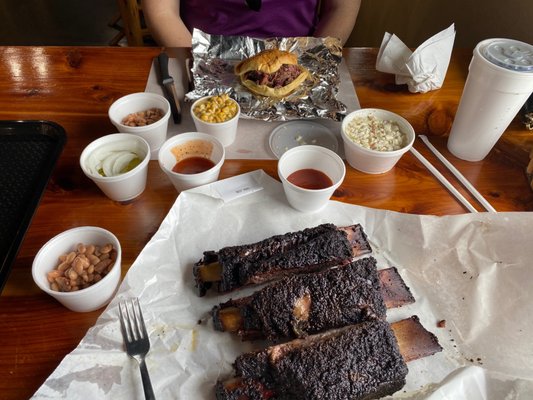 Beef rib, chopped brisket sandwich, spicy corn, beans and coleslaw.