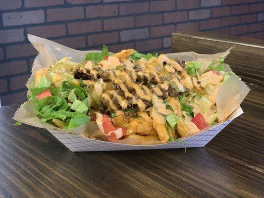 Daddy O's famous Cheeseburger Fries - fries loaded down with our season ground beef patties, lettuce, tomatoes, pickles and secret sauce!