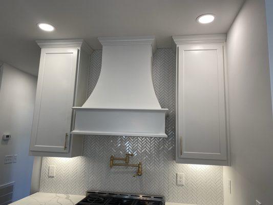 Under cabinet lighting , recessed lighting and kitchen hood installation