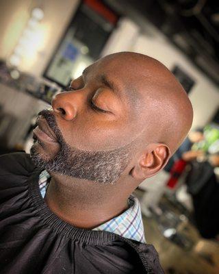 Bald head and taper on beard