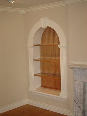 Custom built in niches with glass shelves.Saratoga