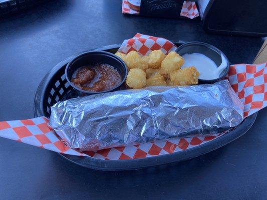 Super tasty breakfast burrito with tater tots