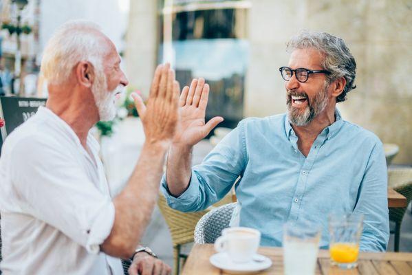 Son spending time with his father at a restaurant.