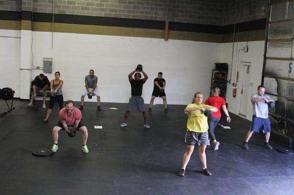 Here we have our awesome athletes doing some kettle bell swings!