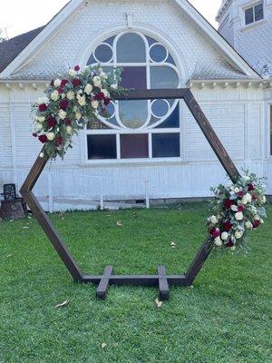 Wood Hexagon arch. Brown stain.  (NOT INCLUDED: flowers)