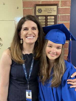 Mrs Wawrzyniak, Head of School with an 8th grade graduate, who was named Citizen of the Year.