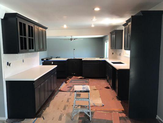 Opened up wall and installed New quartz counters and cabinets