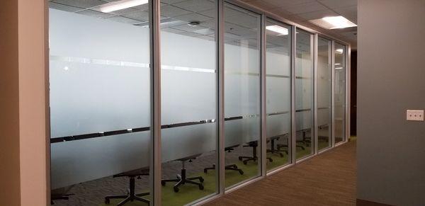 A band of 3M Dusted Crystal provides elegant privacy for your office.