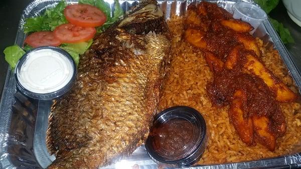 jollof rice fish with plaintain and salad