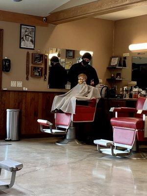 Little guy getting a haircut.