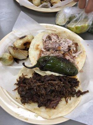 Barbacoa and carnitas tacos ( freshly made corn tortillas)