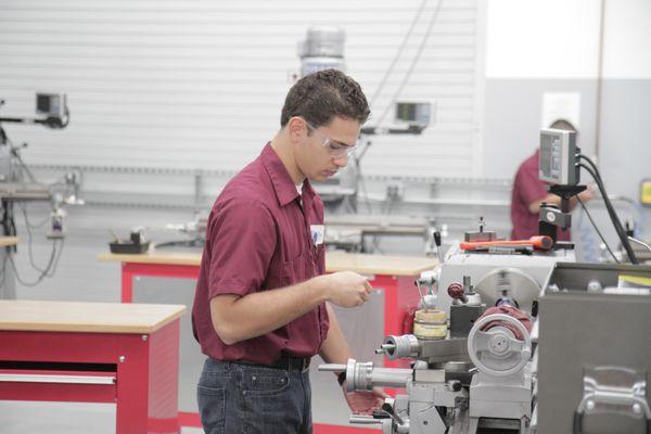 Student working in our CNC Machining Lab at Central City.